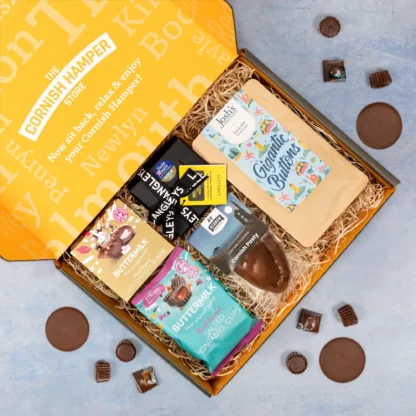 Cornish chocolate gift hamper filled with Kernow chocolate cornish pasty, Langleys chocolate selection box, Joshs gigantic buttons, Buttermilk salted caramel cups and a hot chocolate bombe