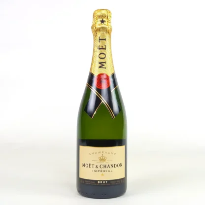 A singular green glass bottle of Moet and Chandon with black and gold detailing