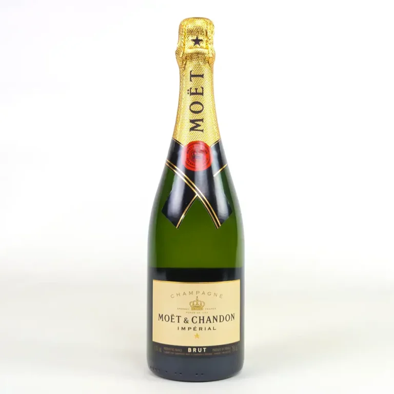 A singular green glass bottle of Moet and Chandon Champagne with black and gold detailing