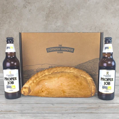 Giant Cornish Pasty surrounded by two bottles Proper Job IPA and a Cornish Hamper Store box