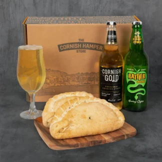 Father's Day Cider and Pasty Hamper presented with two cornish pasties beside Healeys Cornish Gold and Rattler Original