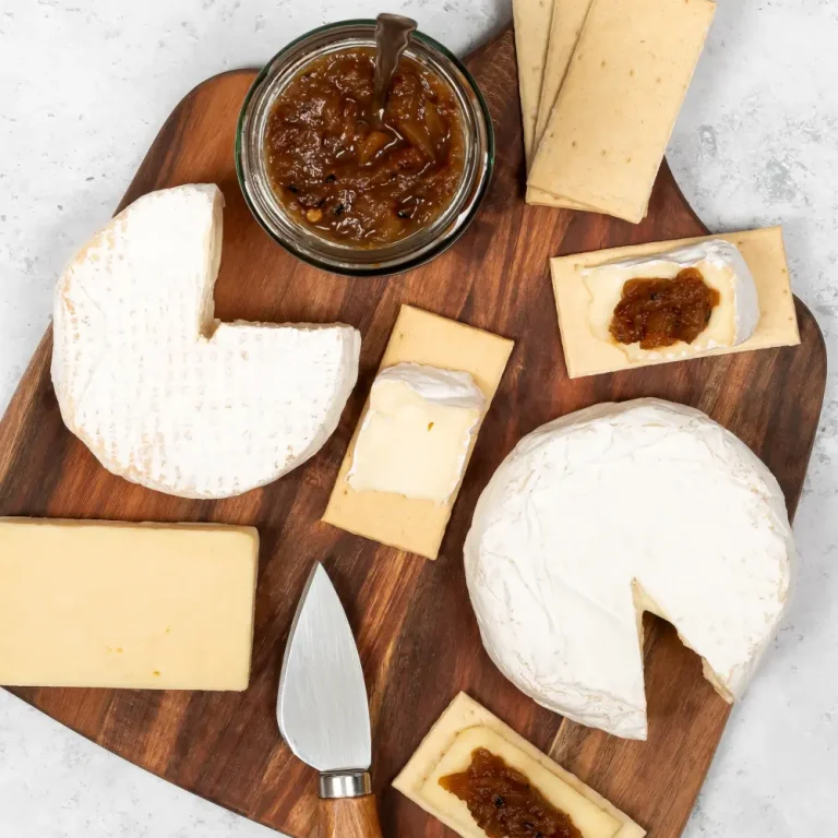 Selection of Cornish cheeses sliced and placed onto Popti thins with cornish chutney