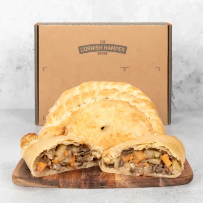 Trio of Baked Prima Pasties. The pasty in the front has been sliced in half to present the filling
