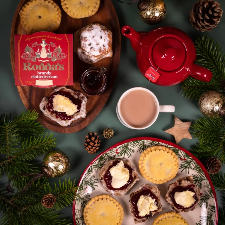 The Christmas Cream Tea Gift Hamper. Christmas scones are topped with strawberry and cranberry jam and Rodda's clotted cream