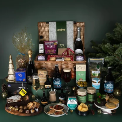 The Christmas Treasures Hamper Gift with Cornish Lust, alcohol free prosecco, chocolate pearls and more in a wicker basket