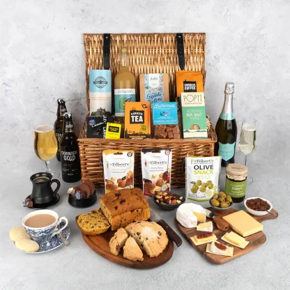 The Cornish Feast Hamper displayed in wicker basket filled with the finest local produce