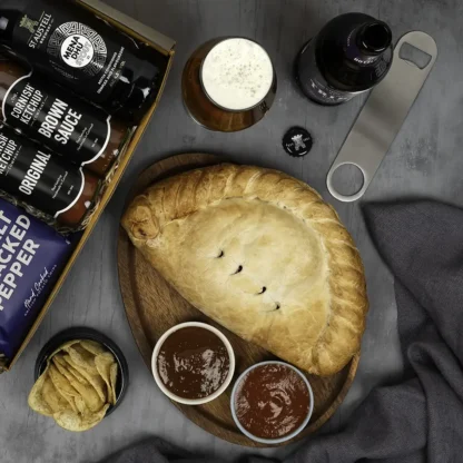 Giant 900g pasty with bottle opener, Tribute pale ale, Mena Dhu stout, ketchup and brown sauce. Served and ready for dad