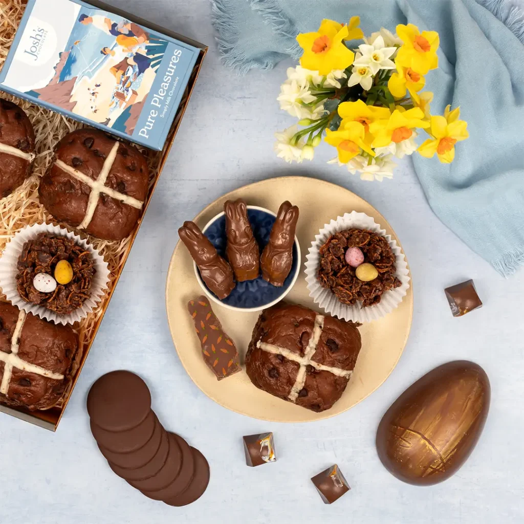 Easter Chocolate gift basket with a luxury chocolate easter egg, chocolate bunnies and hot cross buns