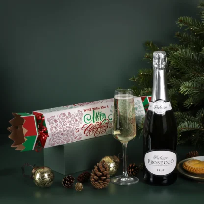 The Prosecco Christmas Cracker Gift Set filled with a bottle of bubbly. Merry Christmas print on the gift wrapping