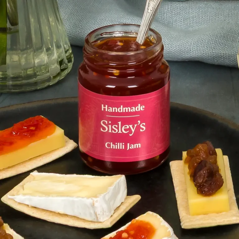 Sisley's chilli jam placed on top of cheese and crackers