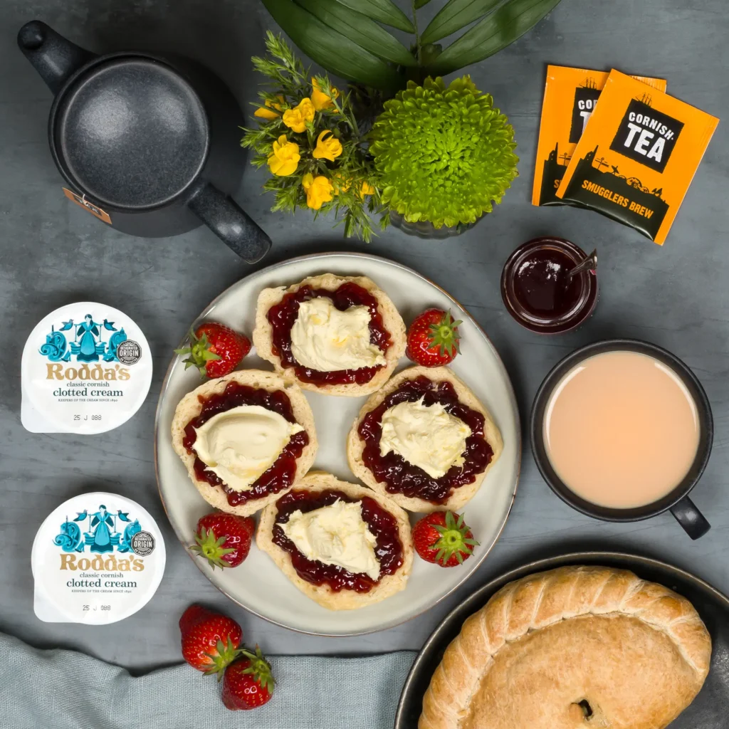Traditional steak Cornish pasty beside cream teas from Dad's Pasty Postal Hamper