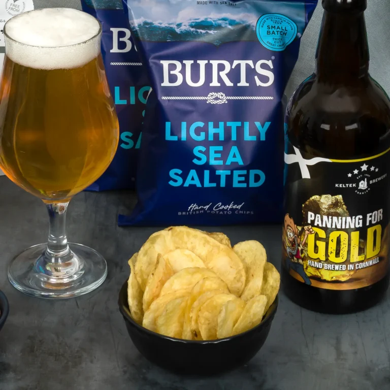 A cold, refreshing glass of Panning for Gold by Keltek Brewery, beside Burts Crisps